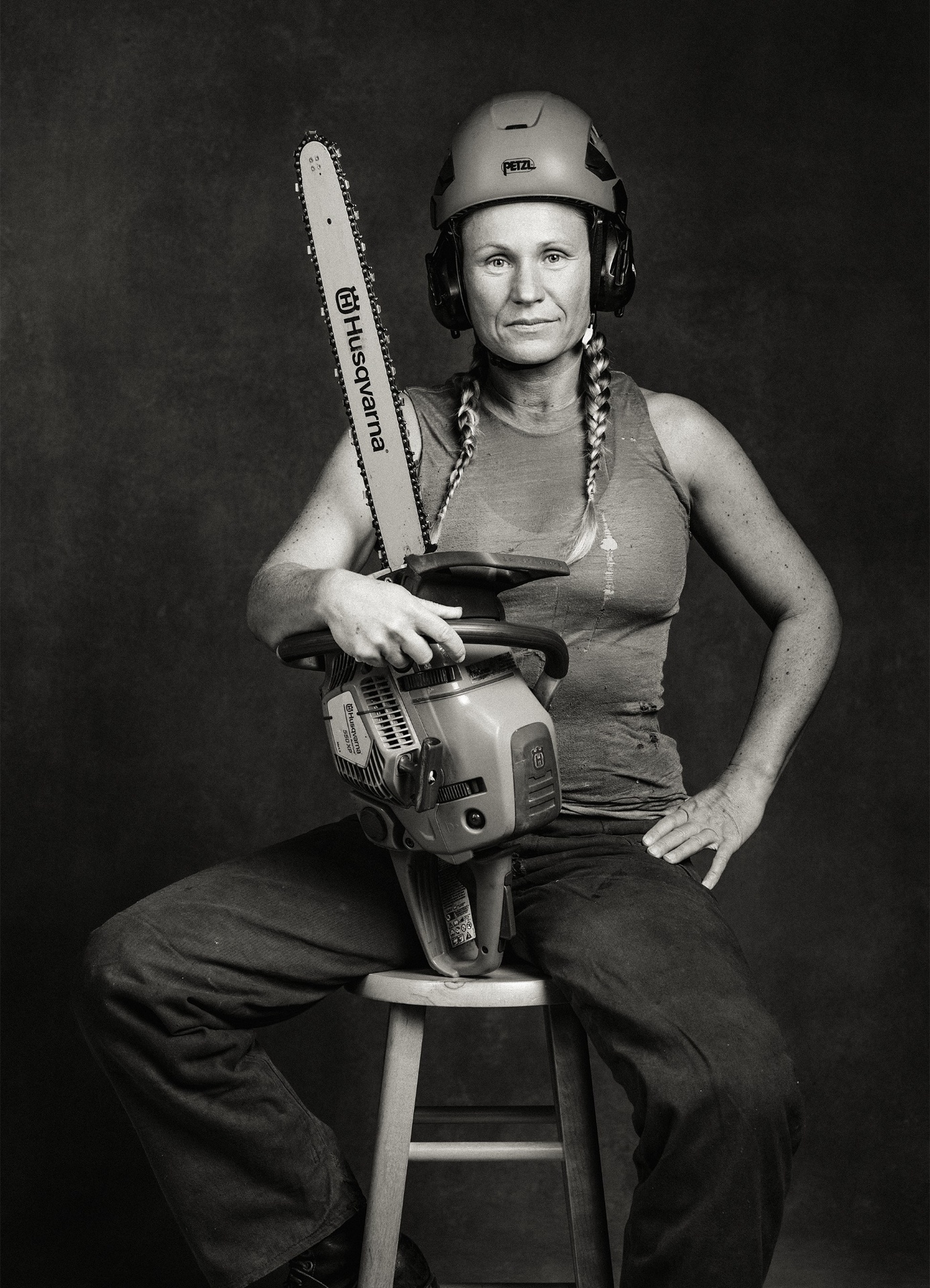 Tradeswoman with chainsaw, photographed by Millissa Martin