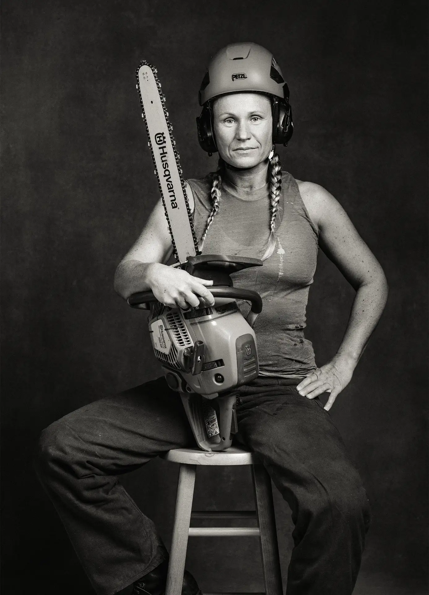 Tradeswoman with chainsaw, photographed by Millissa Martin